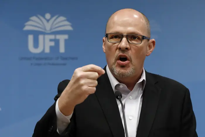 Michael Mulgrew, president of the United Federation of Teachers in New York City, addresses a news conference at UFT headquarters in New York. Mulgrew has applied greater pressure in his negotiations with the city for a new contract.